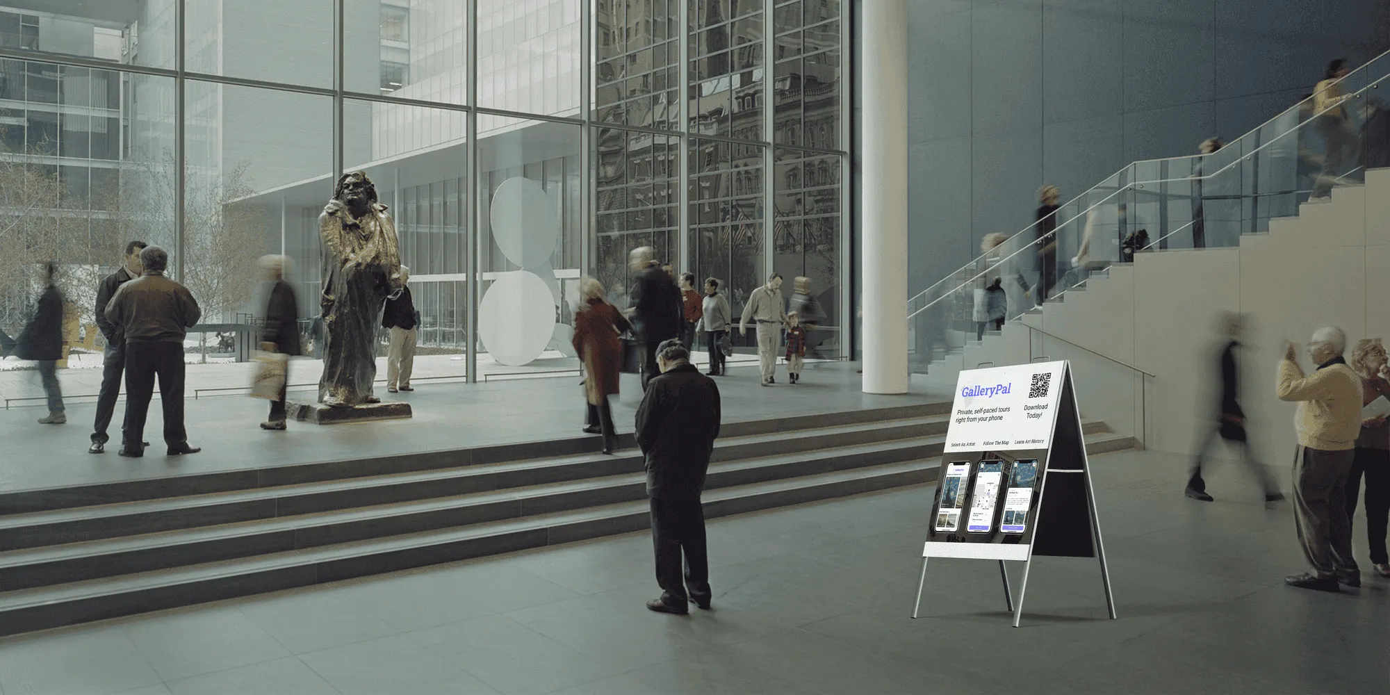 A GalleryPal sign in a bright museum lobby inviting visitors to download the app and start a private tour